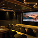Illustration for article titled Greasy Garage or Helluva Home Theater?
